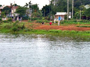 Vietnamese workers along the Perfume River