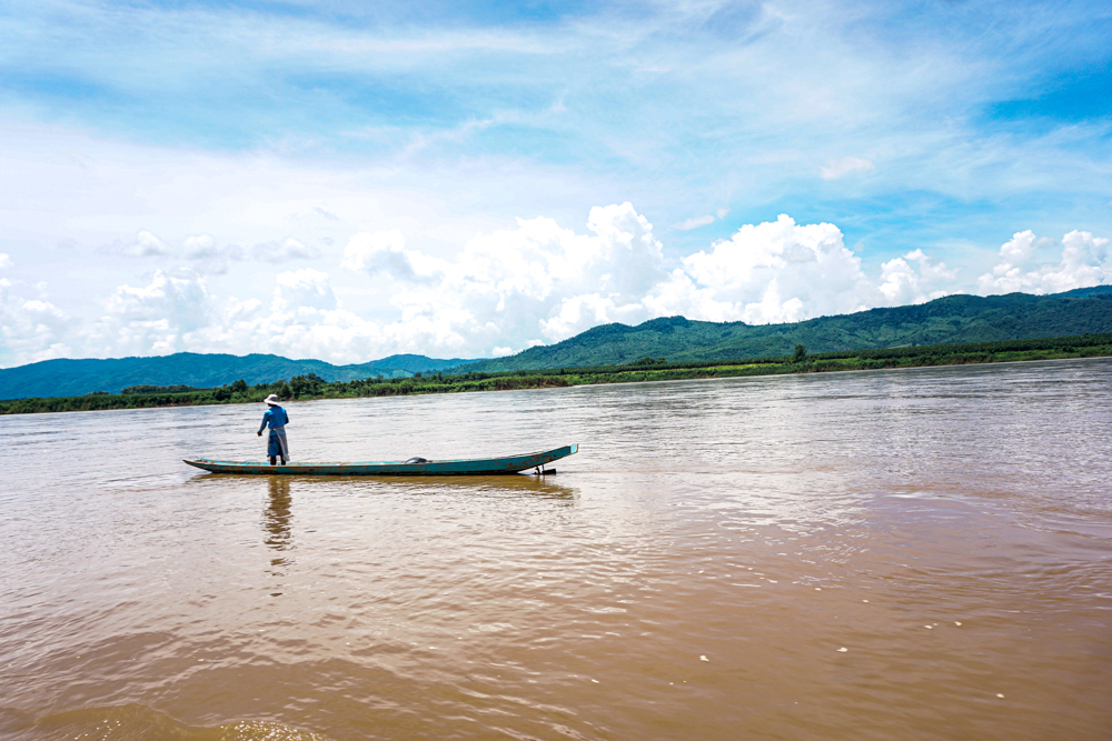 Laos slow boat fisherman